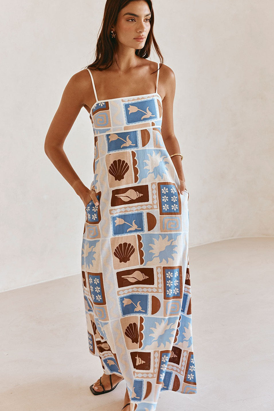 Blue maxi dress with an A-line skirt, back view