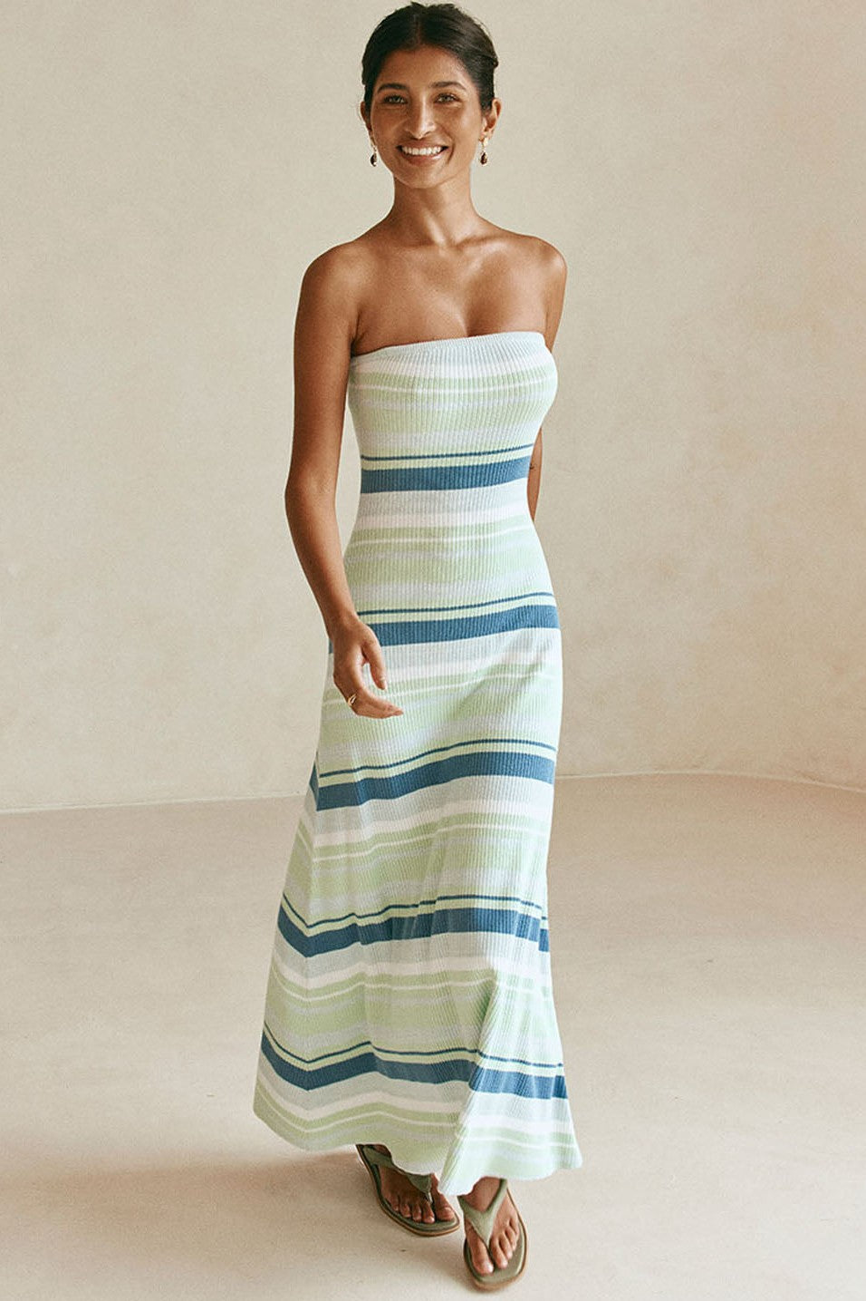 Blue maxi dress with a strapless neckline, styled on model