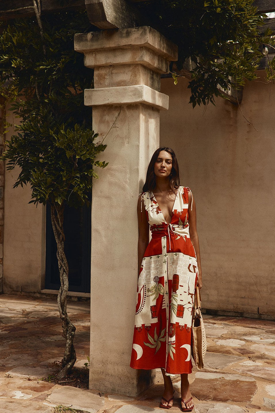Red maxi dress with a V neckline, styled on model