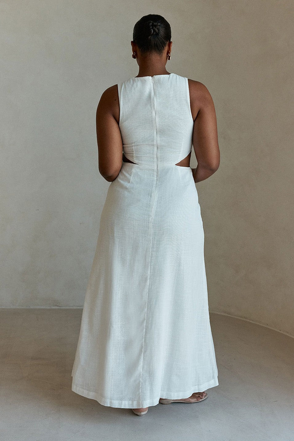 White maxi dress with a sleeveless bodice, back view