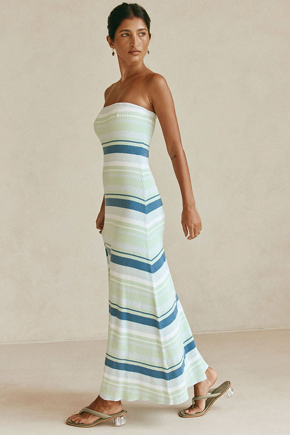 Blue maxi dress with a strapless neckline, side view